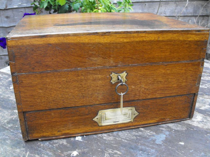 A Good 19thC British Oak Campaign Apothecary Chest to Include Sixty-Seven Bottles
