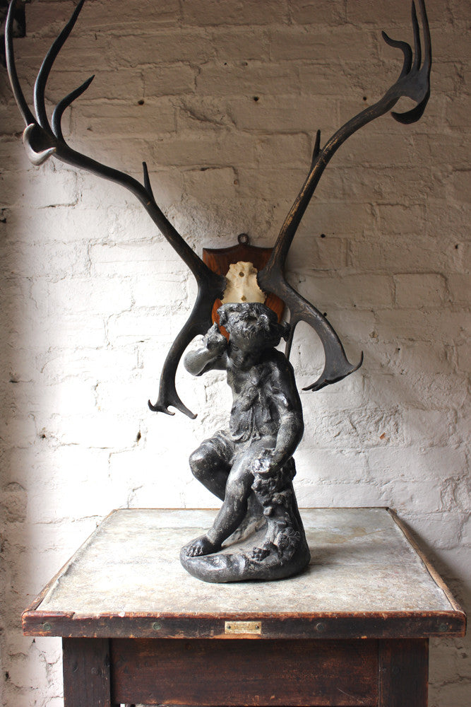 A Beautiful George III Period Lead Garden Ornament Cast as a Bacchanalian Putto