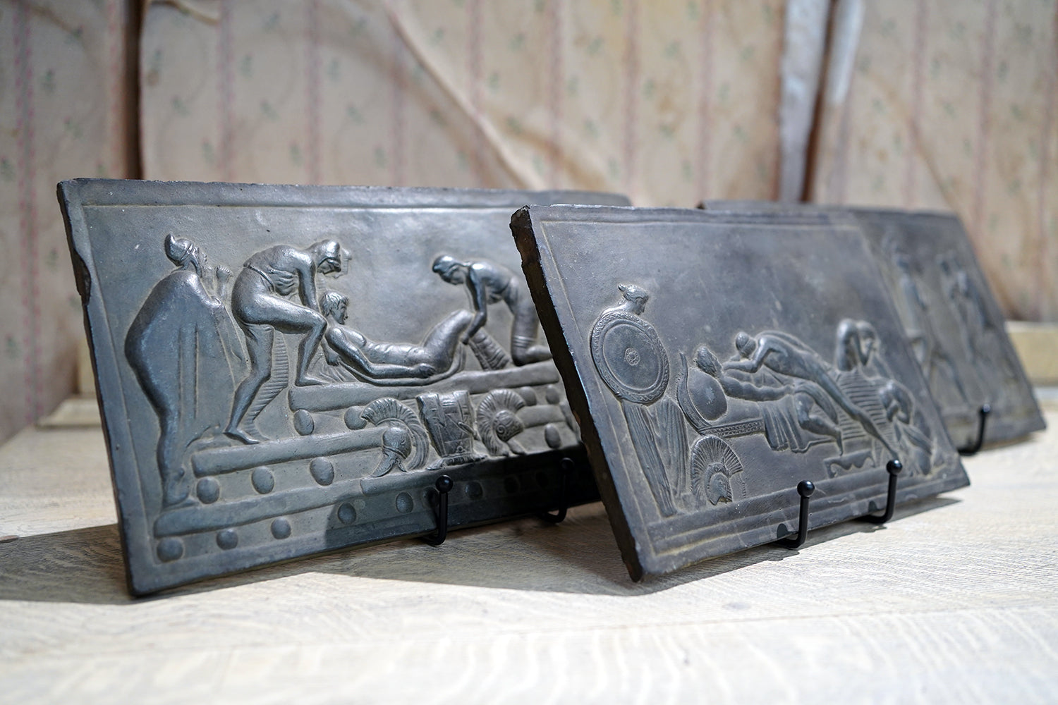 A Decorative Trio of Early 20thC Graduating Slate Plaques Depicting Classical Greek Scenes