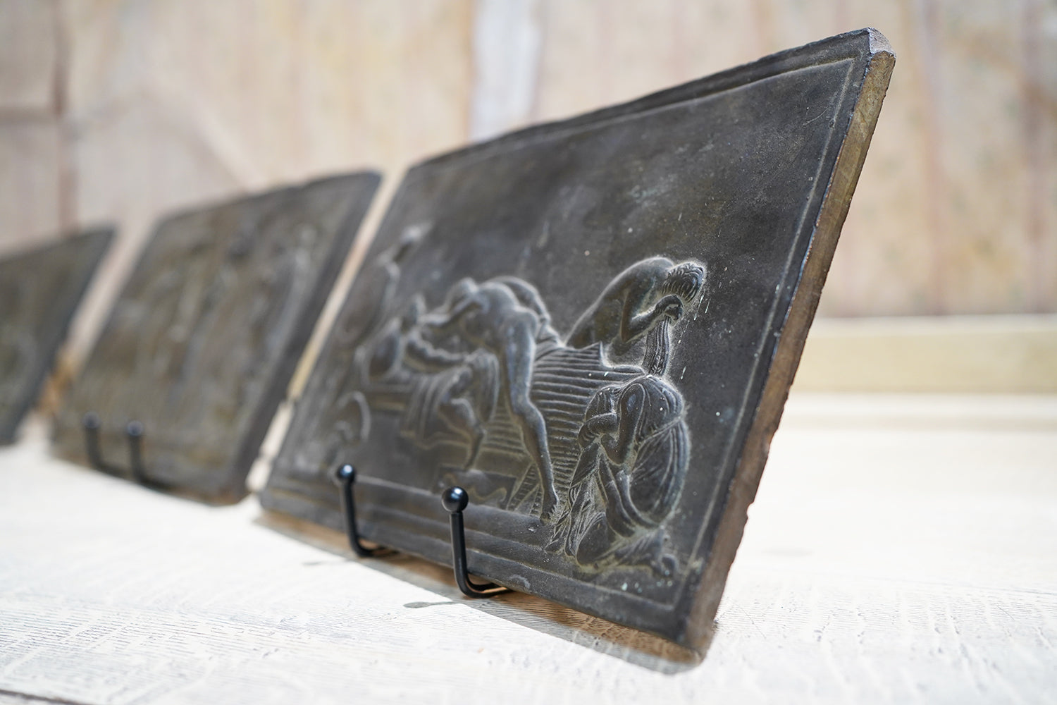 A Decorative Trio of Early 20thC Graduating Slate Plaques Depicting Classical Greek Scenes