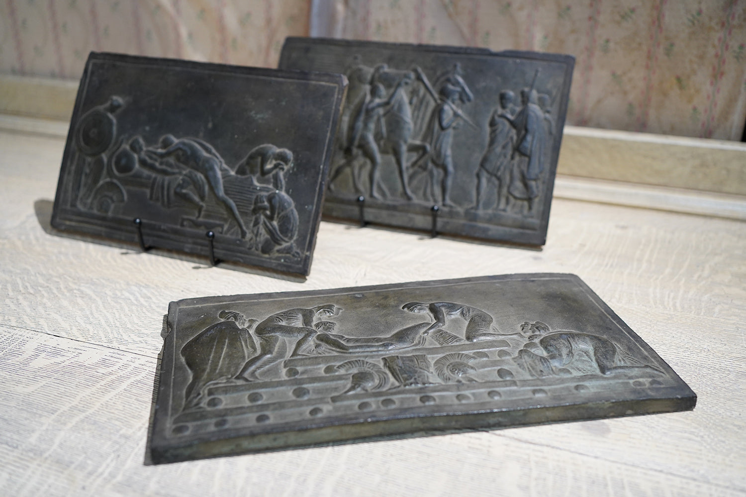 A Decorative Trio of Early 20thC Graduating Slate Plaques Depicting Classical Greek Scenes